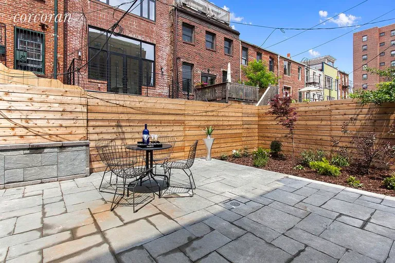 New York City Real Estate | View 411 DeGraw Street | Backyard with Modern Horizontal Fence | View 15