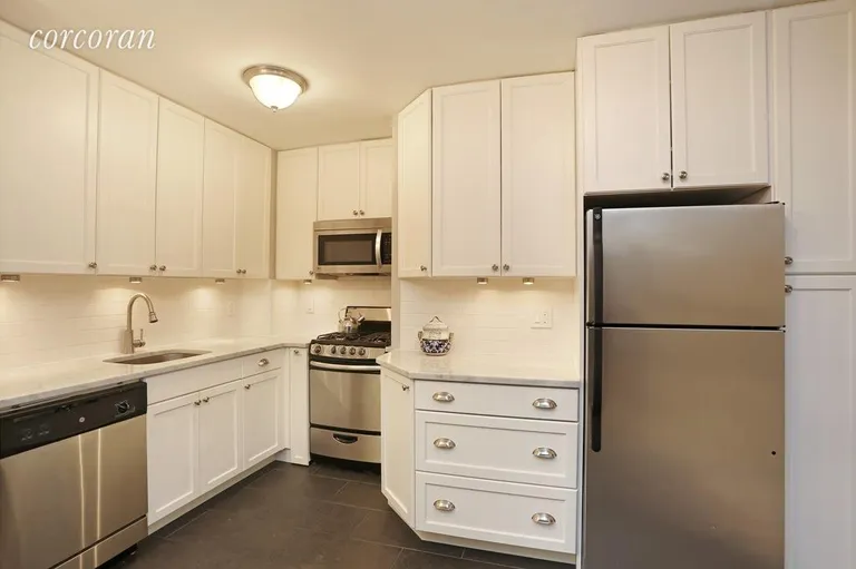 New York City Real Estate | View 309 East 87th Street, 3MN | Inviting kitchen with Carrera marble counter-tops | View 3