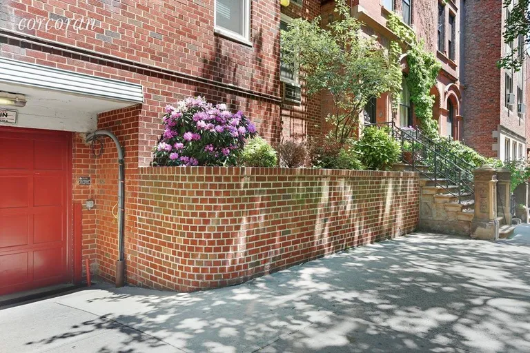 New York City Real Estate | View 309 East 87th Street, 3MN | Building has garage and landscaped exterior | View 12