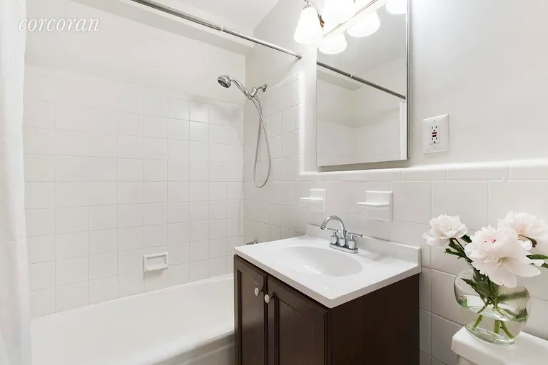 New York City Real Estate | View 123 East 75th Street, 4A | Renovated bathroom with new vanity and lighting | View 3