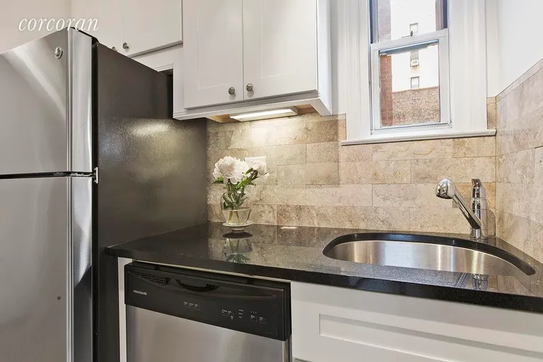 New York City Real Estate | View 123 East 75th Street, 4A | Marble backsplash and stainless steel appliances | View 5