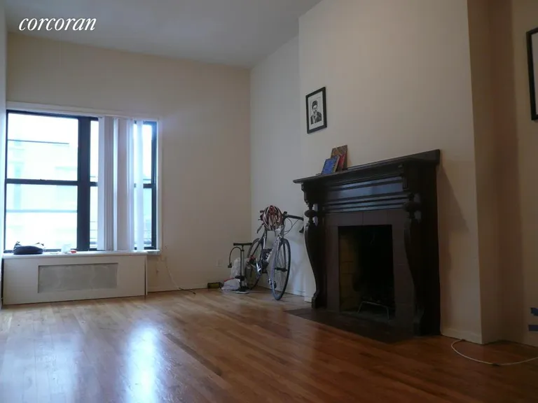 New York City Real Estate | View 234 West 74th Street, 4A | Living room with a decorative fireplace | View 4