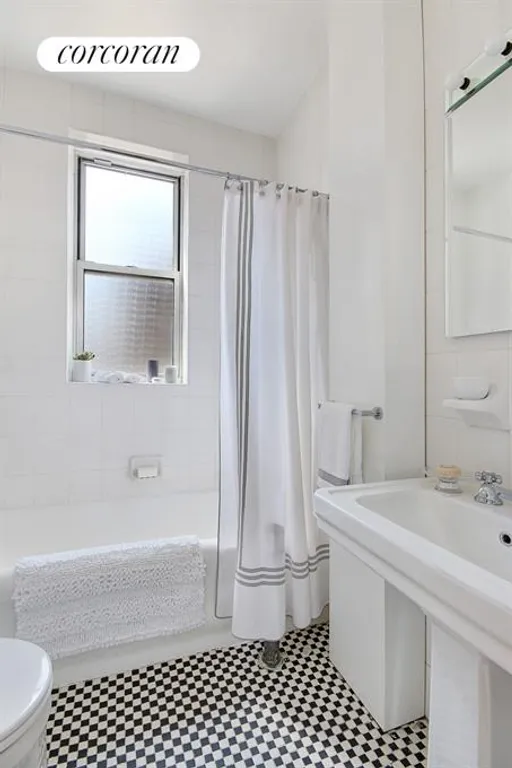 New York City Real Estate | View 241 West 97th Street, 8N | Windowed bathroom with period details | View 5