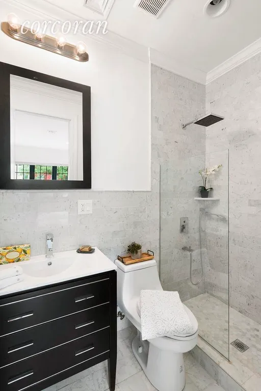 New York City Real Estate | View 748 Madison Street | En-suite master bathroom with glass shower stall | View 5