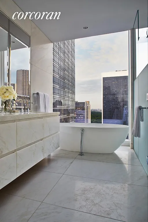 New York City Real Estate | View 20 West 53rd Street, 38A | Master bath with Lido white marble and soaking tub | View 5