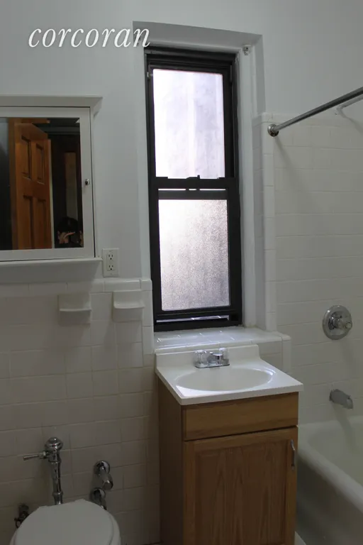 New York City Real Estate | View 95 Cabrini Boulevard, 2F | Renovated Bathroom | View 4