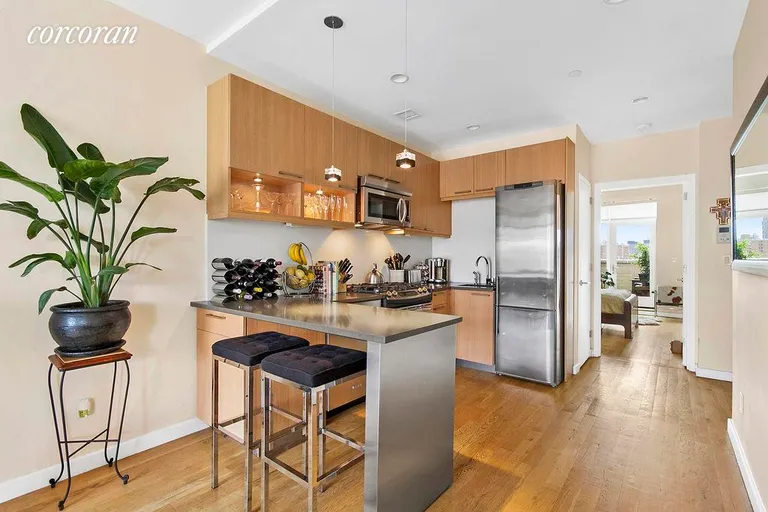 New York City Real Estate | View 330 East 119th Street, 7A | Well appointed kitchen with a breakfast bar  | View 4