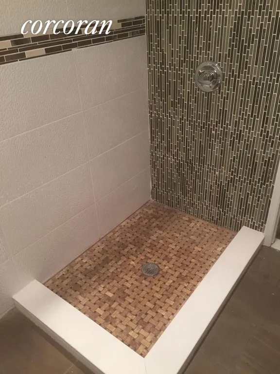 New York City Real Estate | View 86 16th Street, 1 | Marble-Tiled Shower | View 8