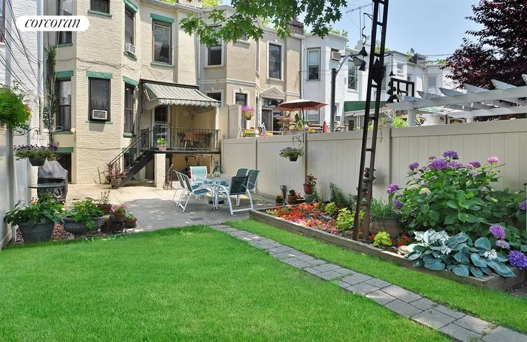 New York City Real Estate | View 526 74th Street | Manicured Garden and Lawn with Patio Seating | View 11