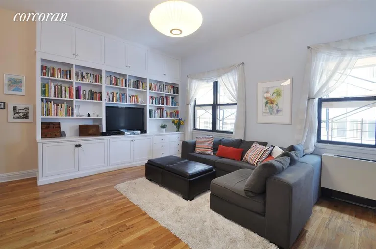 New York City Real Estate | View 60 Court Street, 5F | Large living room with custom built-in wall unit | View 2
