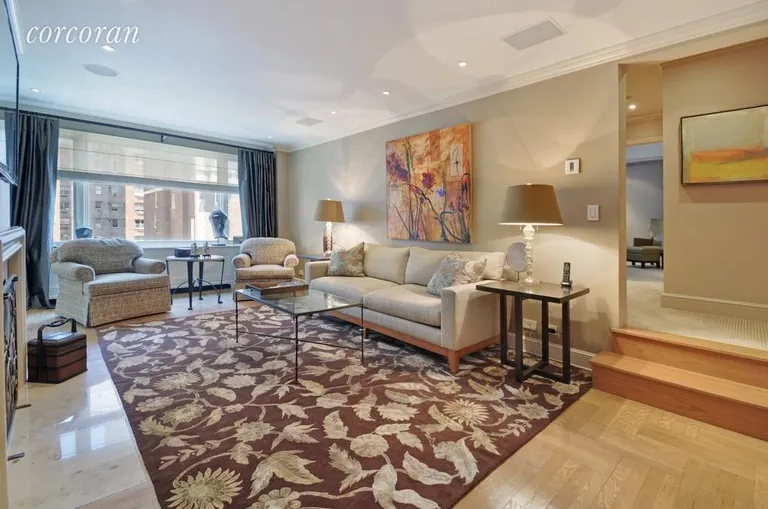 New York City Real Estate | View 2 Sutton Place South, 10A | Den/Sitting Room with wood burning fireplace | View 3