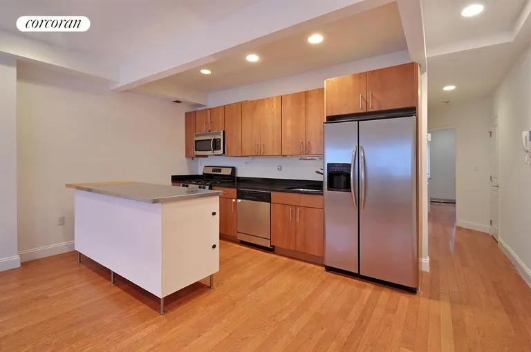 New York City Real Estate | View 525 Vanderbilt Avenue, 1A | Streamlined Modern Kitchen with Island | View 2