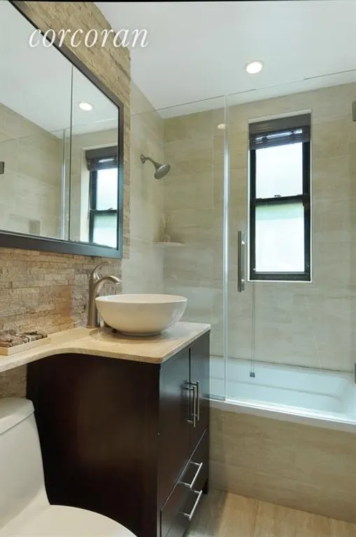 New York City Real Estate | View 30 East 9th Street, 4E | Renovated Windowed Bathroom! | View 5