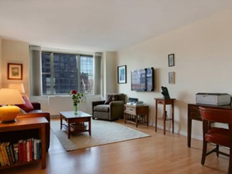 New York City Real Estate | View 301 East 79th Street, 19R | Sunny Living Room with new wood floors | View 2