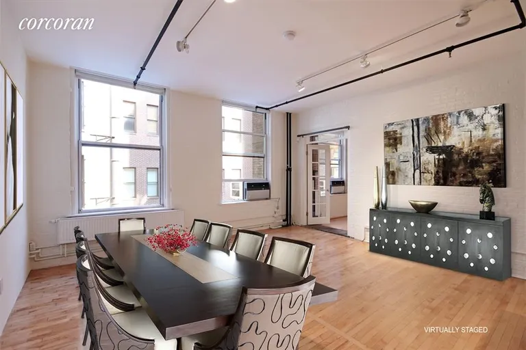 New York City Real Estate | View 108 Wooster Street, 4C | Huge windows throughout let the sun shine in.  | View 2