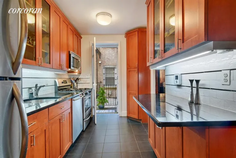 New York City Real Estate | View 90 Prospect Park West, 1R | Cheerful kitchen stepping out to the garden... | View 4