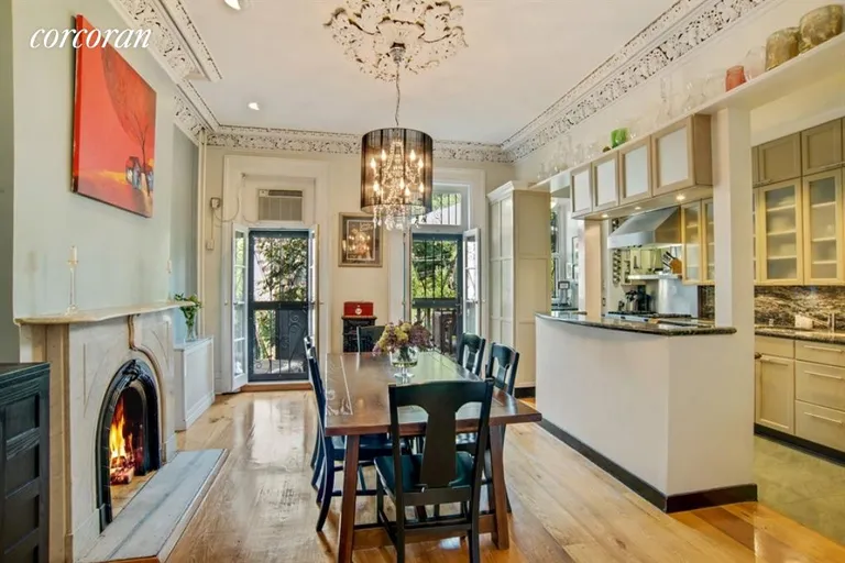 New York City Real Estate | View 160 Hoyt Street, 2 | Dining Room with Fireplace and Kitchen access | View 2
