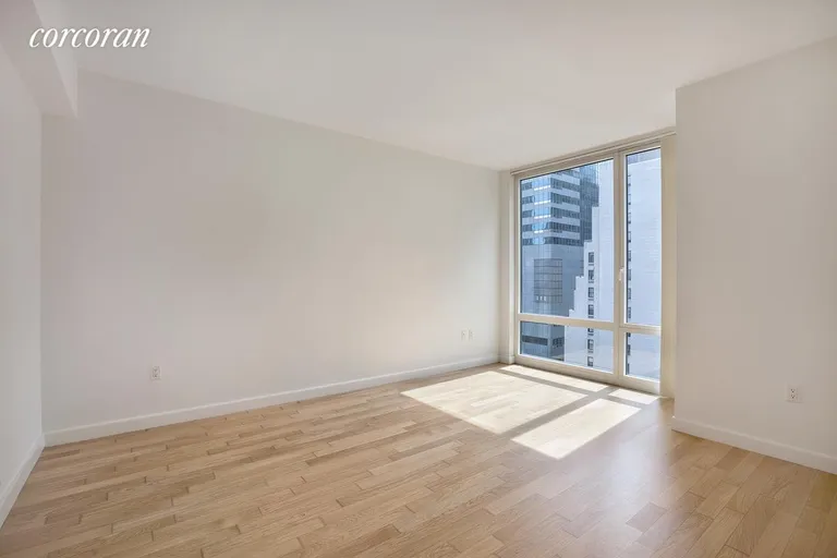 New York City Real Estate | View 247 West 46th Street, 1505 | Unfurnished master bedroom with existing floor | View 7