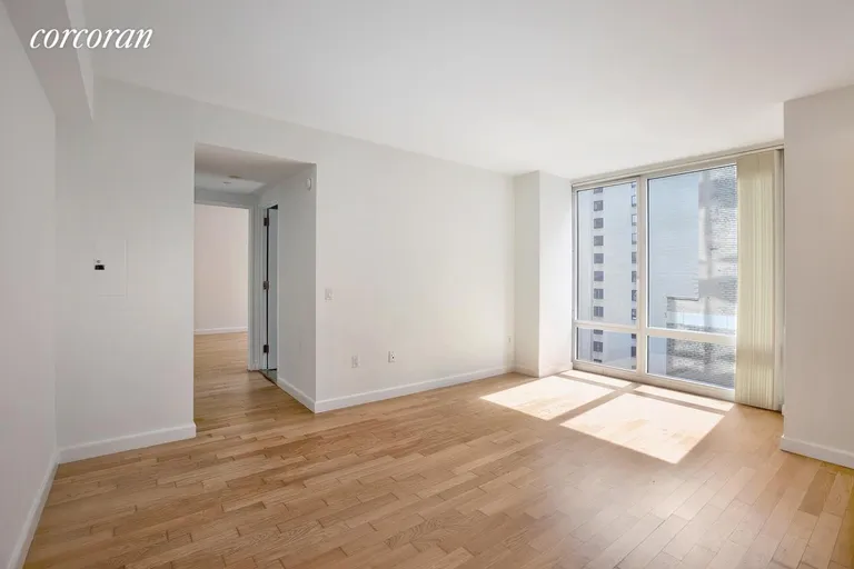 New York City Real Estate | View 247 West 46th Street, 1505 | Unfurnished living room with existing floor | View 4