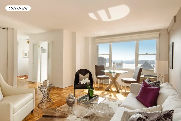 New York City Real Estate | View 61 Jane Street, 18M | Living Room with Hudson River Views | View 2