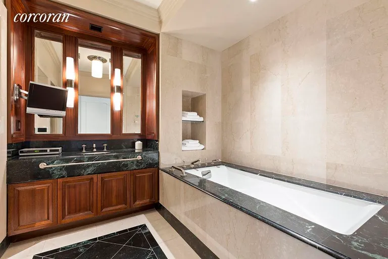 New York City Real Estate | View 55 Wall Street, 804 | Large marble bath with soaking tub & stall shower | View 4