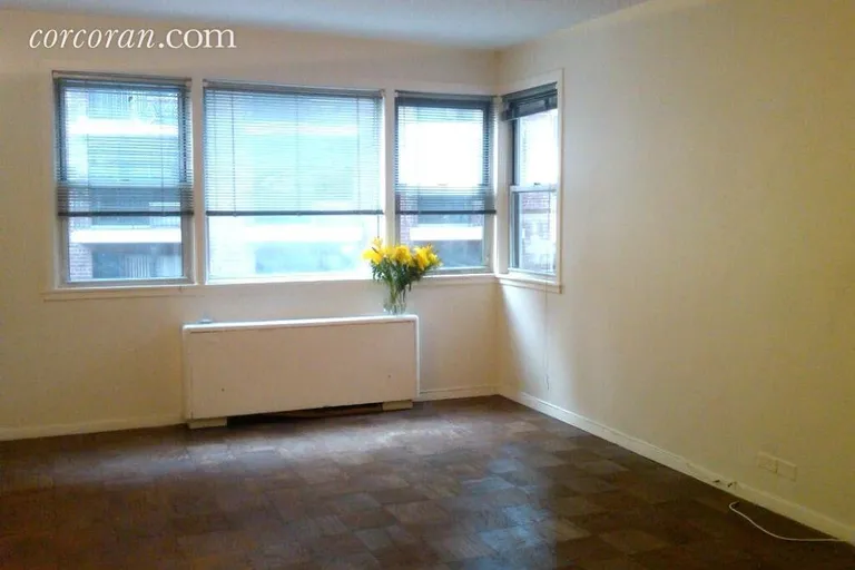 New York City Real Estate | View 77 East 12th Street, 6H | Living Room w/corner window facing south | View 2