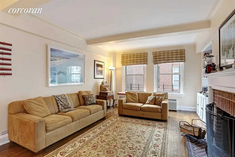 New York City Real Estate | View 315 East 68th Street, 6F | Living Room, south facing, w/woodburning fireplace | View 2