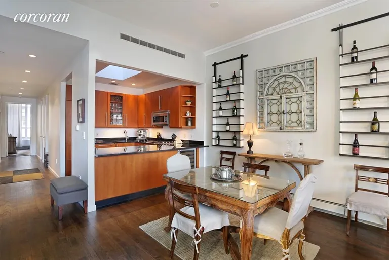 New York City Real Estate | View 237 West 26th Street, PH | Open kitchen with skylight and dining area | View 2