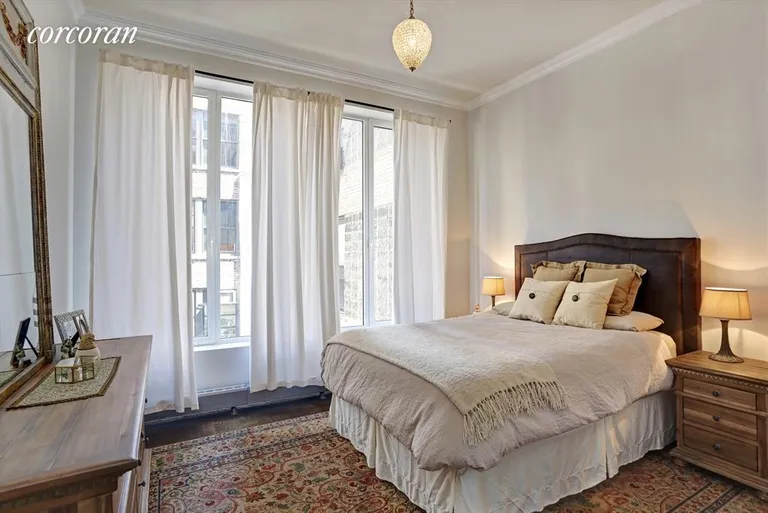 New York City Real Estate | View 237 West 26th Street, PH | Master bedroom with 7' windows and en suite bath | View 3