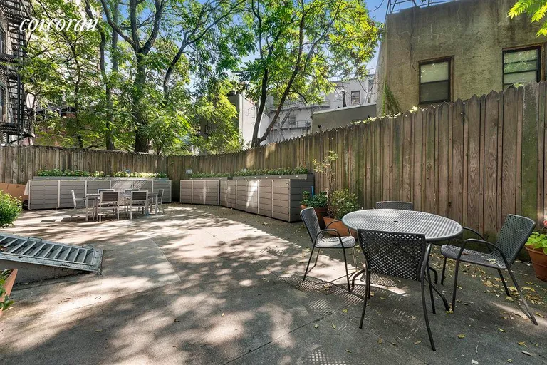 New York City Real Estate | View 26 Cornelia Street, 14 | Quiet Sunny Furnished Backyard with Barbeque | View 4