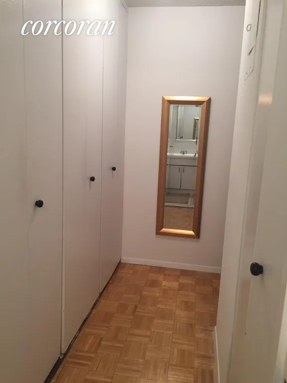 New York City Real Estate | View 301 East 79th Street, 21S | Hallway full of closets | View 5