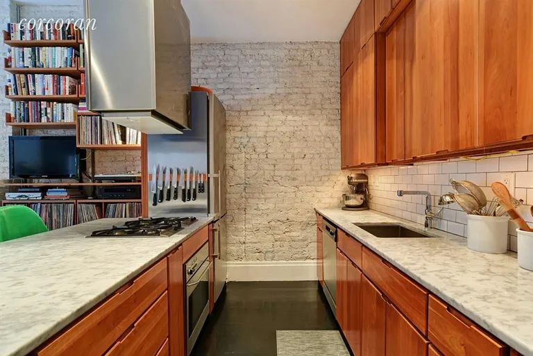 New York City Real Estate | View 31 8th Avenue, 2 | Kitchen features ceiling-height cherry cabinetry | View 3