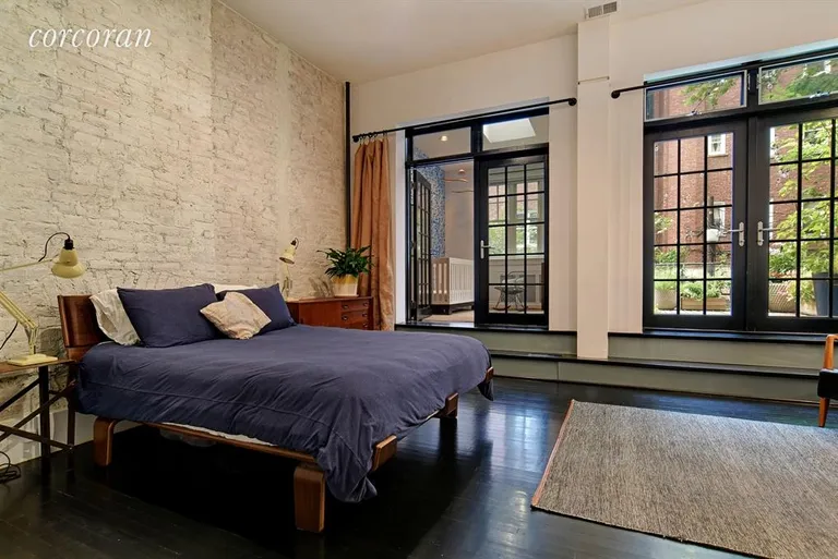 New York City Real Estate | View 31 8th Avenue, 2 | Master bedroom with French doors leading outside | View 4