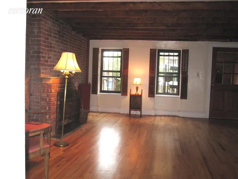 New York City Real Estate | View 208 Wyckoff Street, 1 | Large Living Room with Beamed Ceiling | View 3