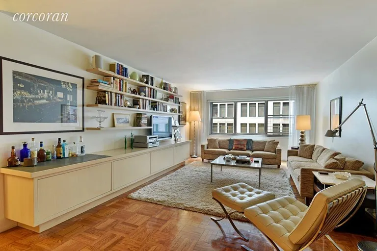 New York City Real Estate | View 70 East 10th Street, 8J | Large open living room w/ built-ins | View 2