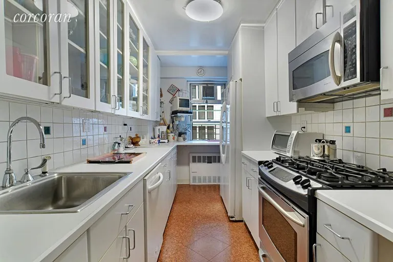New York City Real Estate | View 70 East 10th Street, 8J | Windowed Kitchen | View 3