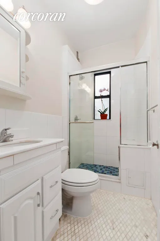 New York City Real Estate | View 340 West 19th Street, 25 | Tranquil windowed bathroom. | View 5