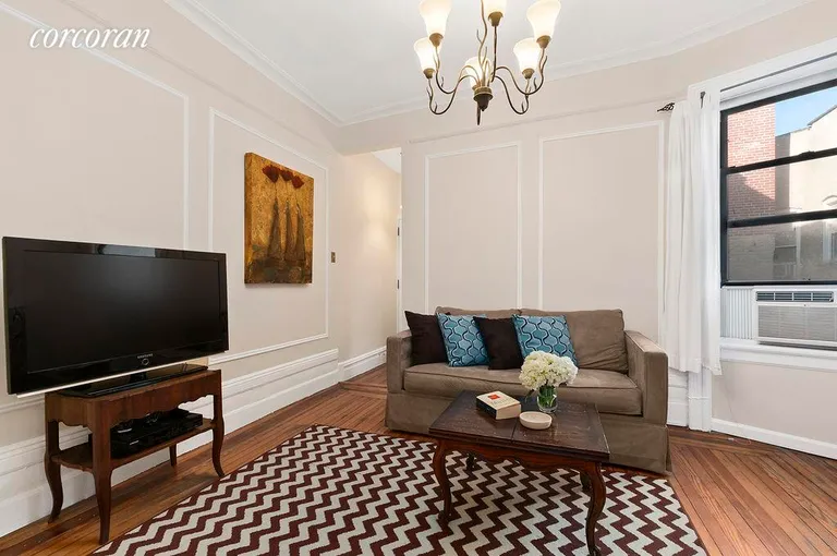 New York City Real Estate | View 340 West 19th Street, 25 | Living room with pre-war details. | View 4