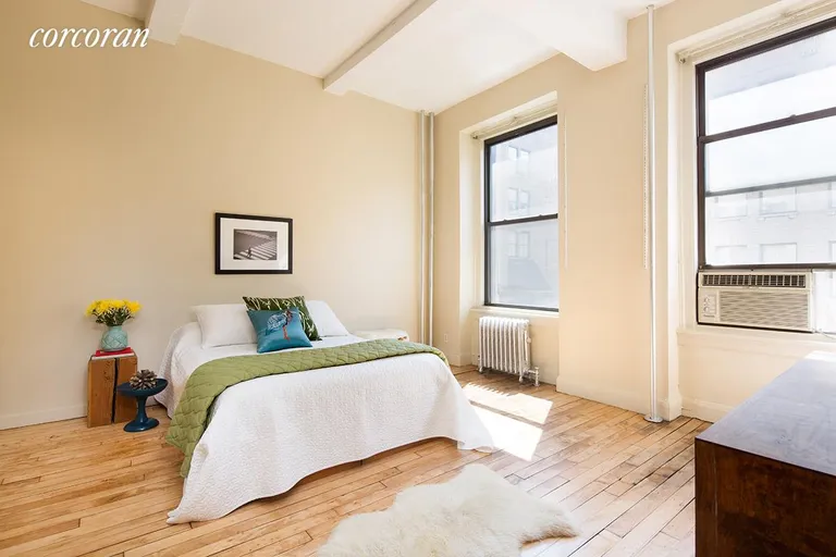 New York City Real Estate | View 121 West 17th Street, 4A | Bright and airy master bedroom with 11ft+ ceilings | View 3