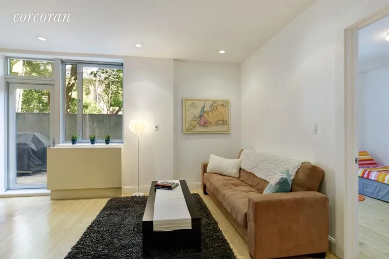 New York City Real Estate | View 35 McDonald Avenue, 1D | Living room flows onto yard | View 2