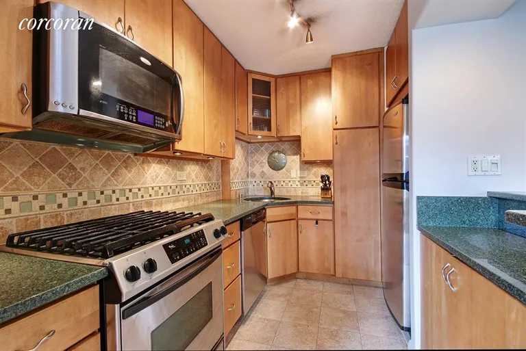New York City Real Estate | View 201 West 70th Street, 11F | Renovated Open Kitchen | View 2