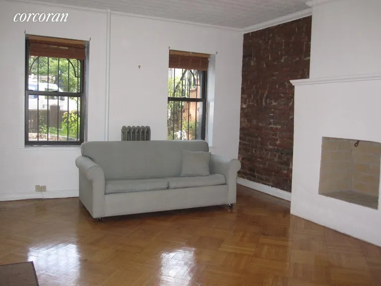 New York City Real Estate | View 203A Bergen Street, 1 | Living Room with Decorative Fireplace | View 2
