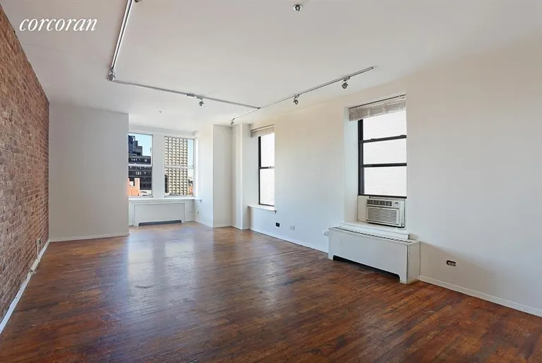 New York City Real Estate | View 60 Pineapple Street, 7E | Living area with two exposures and exposed brick | View 4