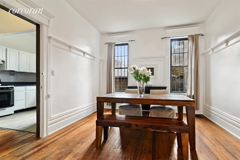 New York City Real Estate | View 120 Clifton Place | Breezy dining room with pocket doors | View 4