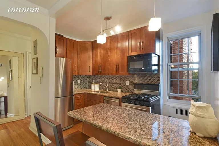 New York City Real Estate | View 360 Clinton Avenue, 3J | Open kitchen with window and breakfast bar | View 3