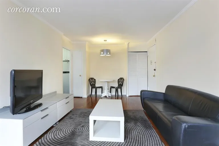 New York City Real Estate | View 77 East 12th Street, 17B | Long Living Room with Dining Area | View 2