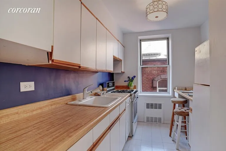 New York City Real Estate | View 245 Henry Street, 3G | Cheerful, windowed kitchen... | View 6