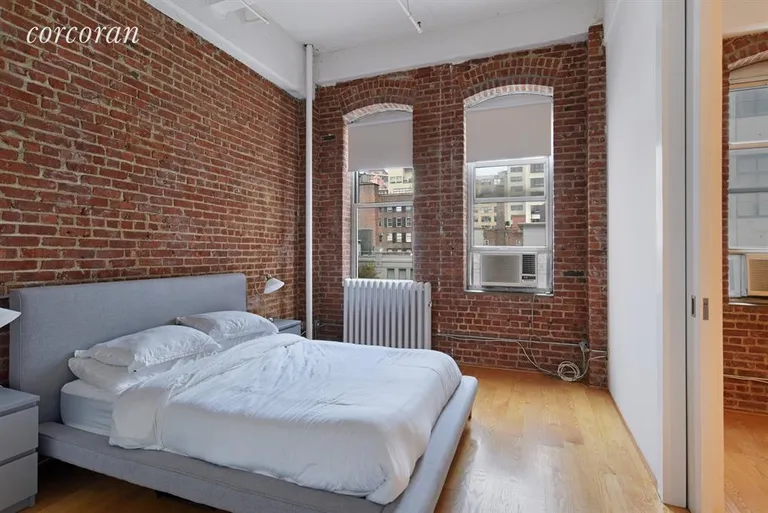 New York City Real Estate | View 521 West 23rd Street, 3R | Separate bedroom with pocket doors | View 5
