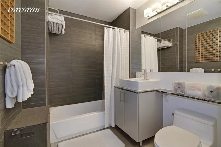 New York City Real Estate | View 5-49 Borden Avenue, 2H | Bathroom with W/D | View 6