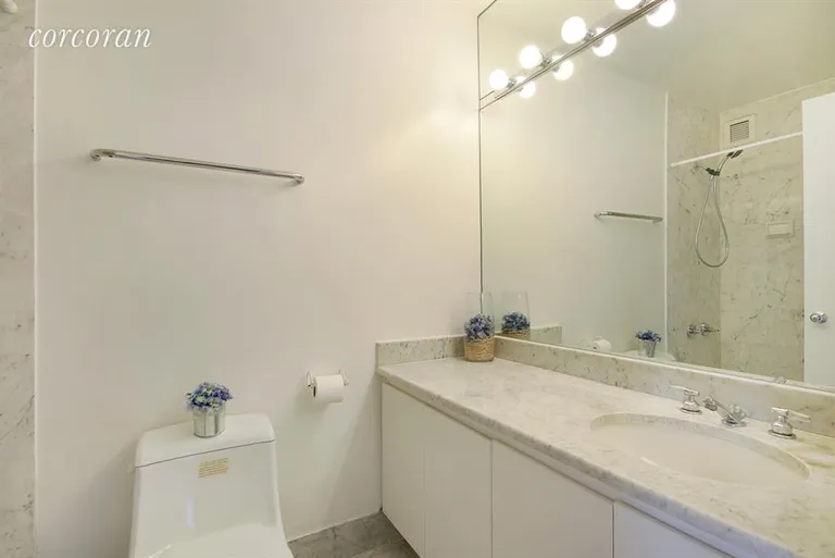 New York City Real Estate | View 45 East 25th Street, 15B | Carrara Marble Bathroom | View 4